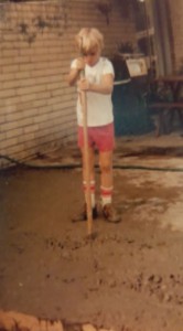 Mark, as a young boy, working and learning the construction business